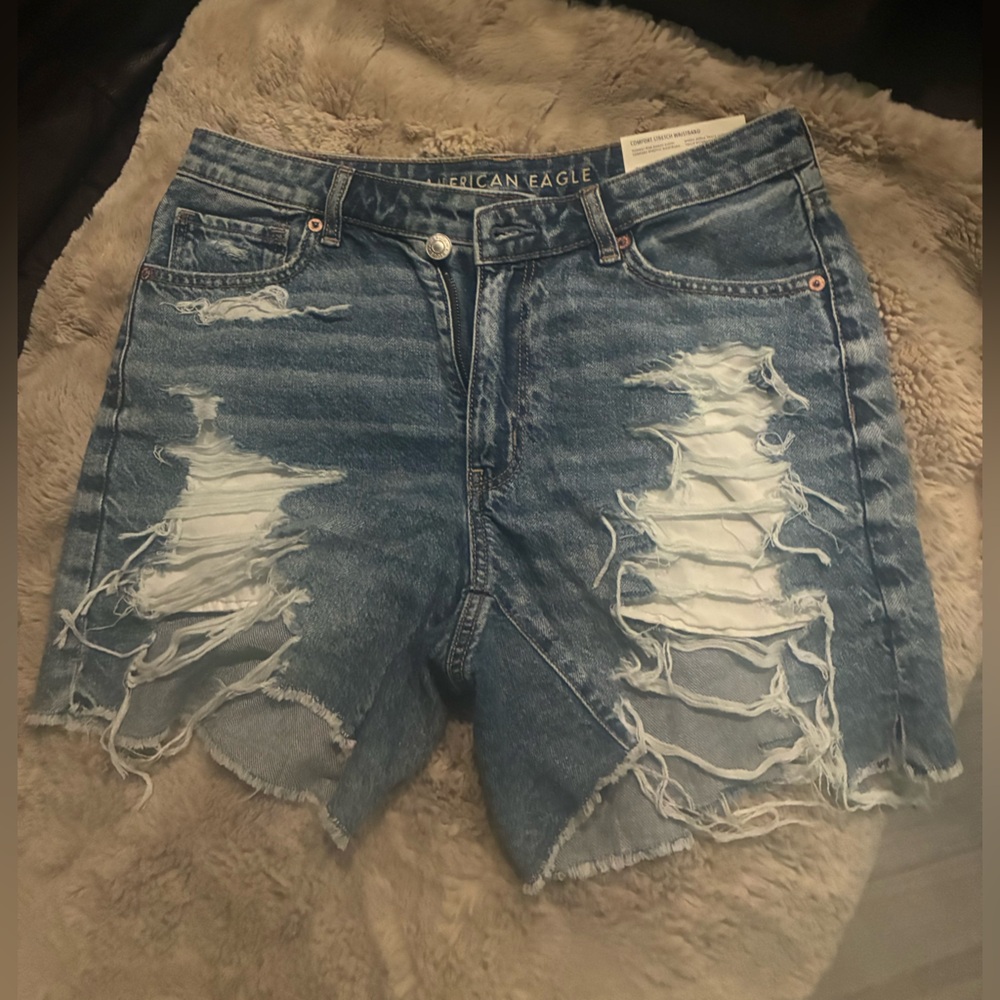 American Eagle Blue Denim Jean shorts with embellished rips.